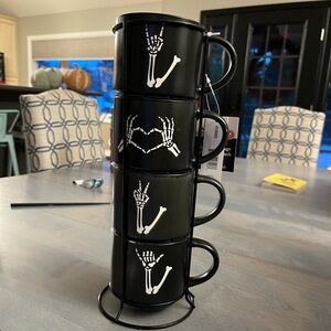 Set of four skeleton mugs with stand